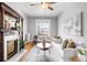 Relaxing living room showcasing a large window, decorative fireplace and cozy seating at 122 N Logan St, Denver, CO 80203