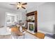 Comfortable living room boasting a fireplace, hardwood floors, ceiling fan and views into the next room at 122 N Logan St, Denver, CO 80203
