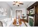 Bright living room featuring a decorative fireplace, wood floors, neutral-colored walls and comfortable furniture at 122 N Logan St, Denver, CO 80203