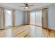 Spacious bedroom with natural light, hardwood flooring and ceiling fan at 20 Scott Dr, Broomfield, CO 80020