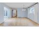 Open dining room with hardwood floors and access to a private patio area at 20 Scott Dr, Broomfield, CO 80020