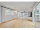 Open dining space with hardwood floors, large windows, and bright natural light at 20 Scott Dr, Broomfield, CO 80020