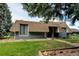 Unique two-story home with blue siding, brown roof, and well-manicured front lawn at 20 Scott Dr, Broomfield, CO 80020