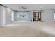 Bright living room featuring neutral paint, carpeting, and plenty of natural light at 20 Scott Dr, Broomfield, CO 80020