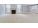 Open living room boasts neutral carpet, fireplace, modern fan, and natural light at 20 Scott Dr, Broomfield, CO 80020