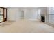 Carpeted living room with modern fireplace, great natural light and spacious closet at 20 Scott Dr, Broomfield, CO 80020