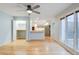 Open living area with hardwood floors, views of the kitchen, and natural lighting at 20 Scott Dr, Broomfield, CO 80020