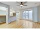Open living space with hardwood floors, views of the kitchen, and plenty of sunlight at 20 Scott Dr, Broomfield, CO 80020