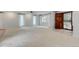 Spacious living room with plush carpeting, natural light, and a ceiling fan at 20 Scott Dr, Broomfield, CO 80020