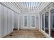 Covered patio space featuring wood flooring, white support beams and natural light at 20 Scott Dr, Broomfield, CO 80020