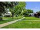 Well-maintained yard features a sidewalk and mature trees at 20 Scott Dr, Broomfield, CO 80020
