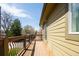Wooden balcony with decorative railing offering outdoor living space to enjoy great views at 452 N Finch Ave # 452B, Lafayette, CO 80026