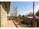 Lovely wooden balcony with decorative metal railing offers outdoor living space and views at 452 N Finch Ave # 452B, Lafayette, CO 80026