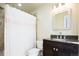 Bathroom with tile shower, granite counters, and wood cabinets at 452 N Finch Ave # 452B, Lafayette, CO 80026
