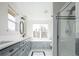 Bright bathroom with a separate shower and tub, and gray cabinets at 452 N Finch Ave # 452B, Lafayette, CO 80026