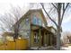 Two-story home featuring a front porch with columns and an olive green color scheme at 452 N Finch Ave # 452B, Lafayette, CO 80026