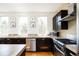 Well-lit kitchen boasts stainless steel appliances and ample counter space at 452 N Finch Ave # 452B, Lafayette, CO 80026