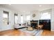 Bright living room features hardwood floors, a fireplace, and abundant natural light at 452 N Finch Ave # 452B, Lafayette, CO 80026