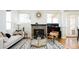 Cozy living room showcasing a fireplace, modern decor, and large windows at 452 N Finch Ave # 452B, Lafayette, CO 80026