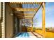 Back patio area with a pergola and a blue patterned rug, perfect for outdoor lounging at 452 N Finch Ave # 452B, Lafayette, CO 80026