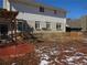 Backyard view of a two story home with a brick patio and partial wooden fence at 1510 S Macon St, Aurora, CO 80012