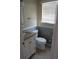 Bathroom with an updated vanity, toilet and wainscotting at 1510 S Macon St, Aurora, CO 80012