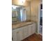 Bathroom featuring an updated vanity, granite countertops, and a view into the shower at 1510 S Macon St, Aurora, CO 80012