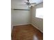 Bedroom featuring a ceiling fan, hardwood floors, and a window at 1510 S Macon St, Aurora, CO 80012