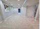 Spacious finished basement with carpeted floors, recessed lighting, and a window bringing in natural light at 8772 S Carr Way, Littleton, CO 80128