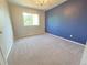 Bright bedroom with carpet, neutral paint, a chandelier, and a large window at 8772 S Carr Way, Littleton, CO 80128