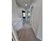 Hallway with neutral colored walls and carpeted stairs leading to the bedrooms at 8772 S Carr Way, Littleton, CO 80128
