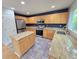 Updated kitchen featuring stainless steel appliances, granite countertops, and an island at 8772 S Carr Way, Littleton, CO 80128