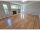 Spacious living room featuring a fireplace and large windows for plenty of natural light at 8772 S Carr Way, Littleton, CO 80128