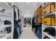 Spacious walk-in closet with custom shelving and ample storage space for clothing, shoes, and accessories at 10291 E 142Nd Ave, Brighton, CO 80602