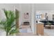 Light-filled foyer with a view into the living area and kitchen, highlighting an open-concept design at 10291 E 142Nd Ave, Brighton, CO 80602