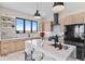 Well-equipped kitchen with marble countertops, modern appliances, a kitchen island, and pendant lighting at 10291 E 142Nd Ave, Brighton, CO 80602