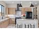 Spacious kitchen with modern appliances, a kitchen island with seating, and stylish cabinetry at 10291 E 142Nd Ave, Brighton, CO 80602