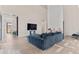 Bright and airy living room with modern decor, hardwood floors and lots of natural light at 10291 E 142Nd Ave, Brighton, CO 80602
