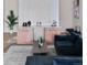 Modern living room featuring stylish decor, a plush sofa, and elegant built-in cabinets with marble countertops at 10291 E 142Nd Ave, Brighton, CO 80602