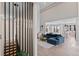 Open-concept living area featuring a modern staircase, comfortable seating, and views of the kitchen at 10291 E 142Nd Ave, Brighton, CO 80602