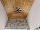 High ceilings with ceiling fan and stone accent wall on patio at 10291 E 142Nd Ave, Brighton, CO 80602