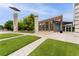 Landscaped community center showcasing modern architecture with stone accents and manicured lawn at 9503 Longs Peak Dr, Commerce City, CO 80640