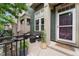 Charming front porch has outdoor seating, potted plants, and a storm door, offering a cozy outdoor space at 9503 Longs Peak Dr, Commerce City, CO 80640