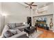 Bright living room boasts hardwood floors, a vaulted ceiling, and a cozy sectional sofa for relaxing and entertaining at 9503 Longs Peak Dr, Commerce City, CO 80640
