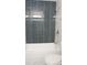 Modern bathroom with subway tile and white bathtub at 6769 W Fair Dr, Littleton, CO 80123
