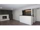 Living room with built-in bar and hardwood floors at 6769 W Fair Dr, Littleton, CO 80123