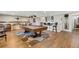 Spacious basement featuring a pool table, bar area with barrel seating, and hardwood-style floors at 2533 W 110Th Ave, Westminster, CO 80234