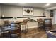 Finished basement area featuring custom barrel tables and barstool seating at 2533 W 110Th Ave, Westminster, CO 80234