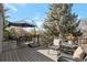 Relaxing deck with comfortable seating, umbrella coverage, and a serene outdoor view at 2533 W 110Th Ave, Westminster, CO 80234