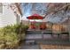 Cozy backyard deck with seating, an umbrella, and mature trees, creating a private retreat at 2533 W 110Th Ave, Westminster, CO 80234